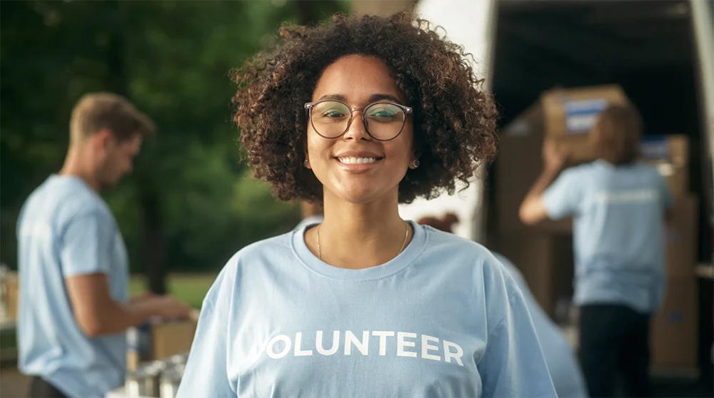 African American woman in t-shirt with the word Volunteer on it
