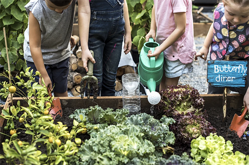 Kids watering garden