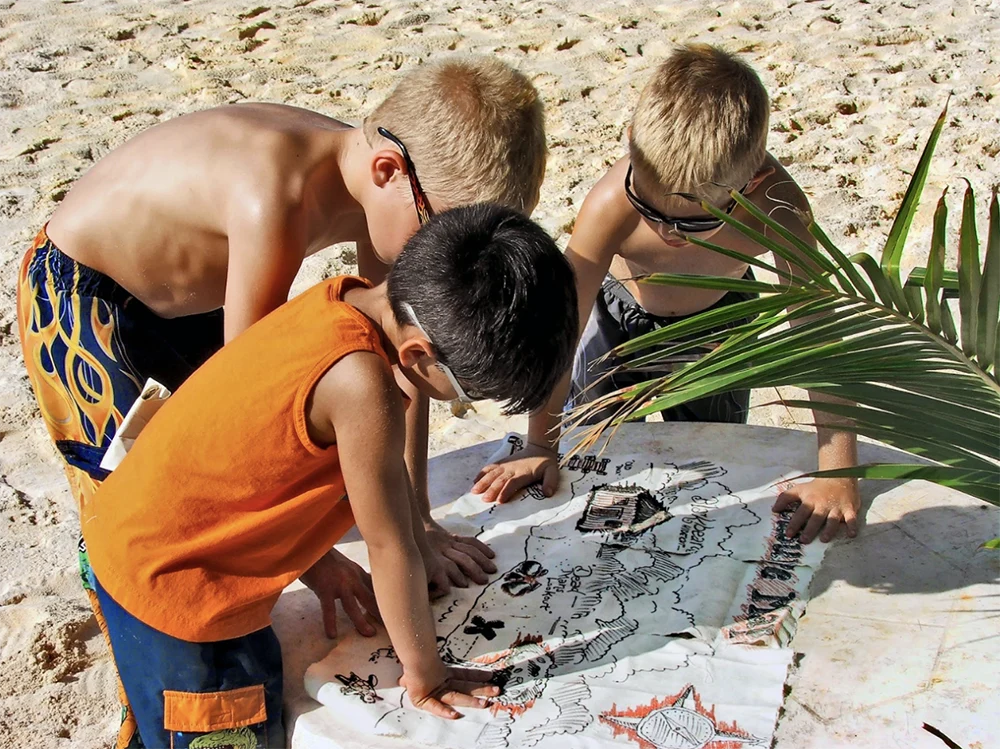 kids looking at treasure map